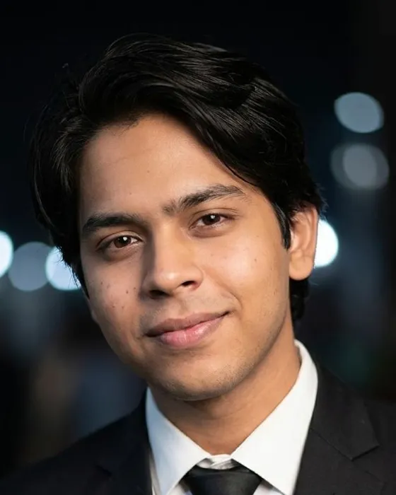 Hasan Waheed, the person who runs each search, in black and white